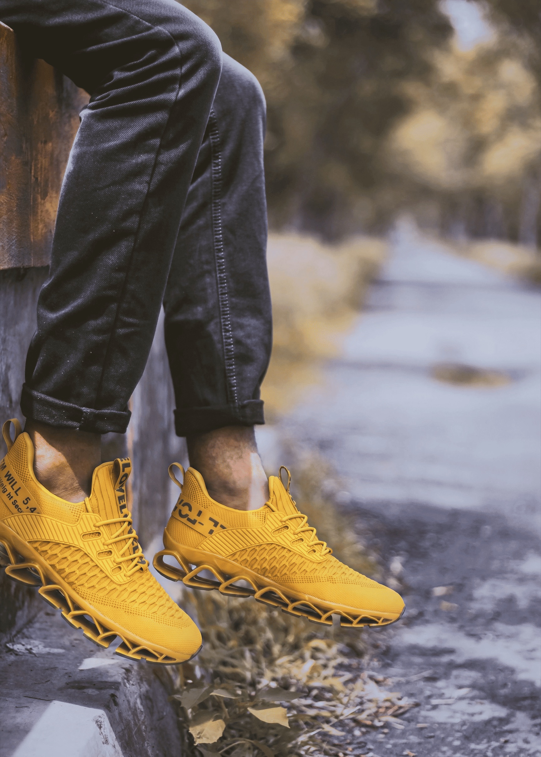 Yellow shoe worn on a street ledge, shown at full quality